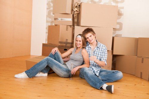 Man with van removal team loading furniture for a Selsdon move