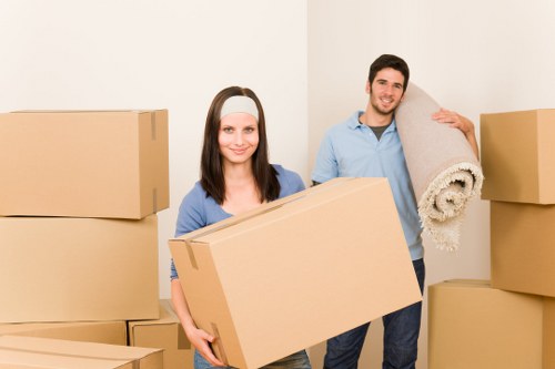 Helper loading furniture into a moving van in Selsdon