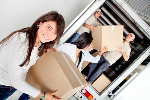 Unpacking boxes and organizing household items after a move in Selsdon