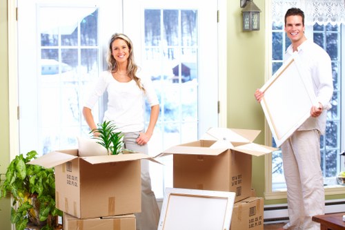 Professional movers loading furniture for a local move